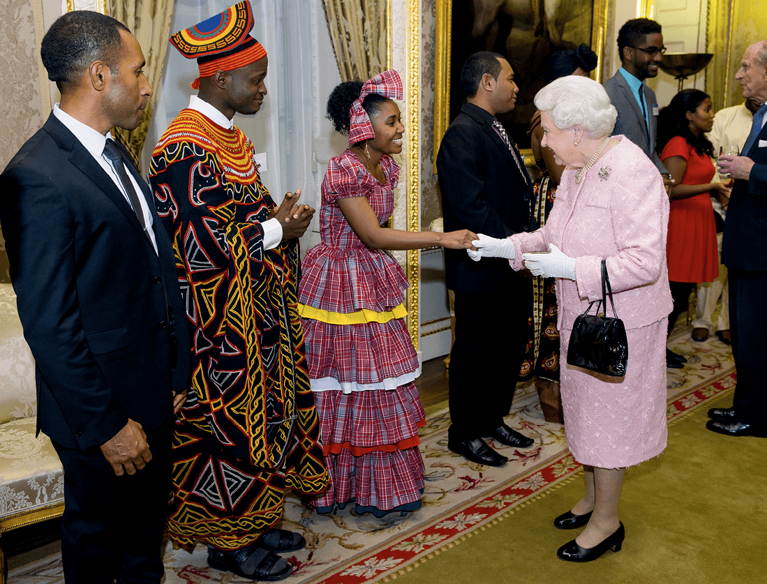 Queen Elizabeth II meets Africa Regional Winner of the
Commonwealth Youth Awards Achaleke Christian Leke and
Caribbean Regional Winner Shamoy Hajare