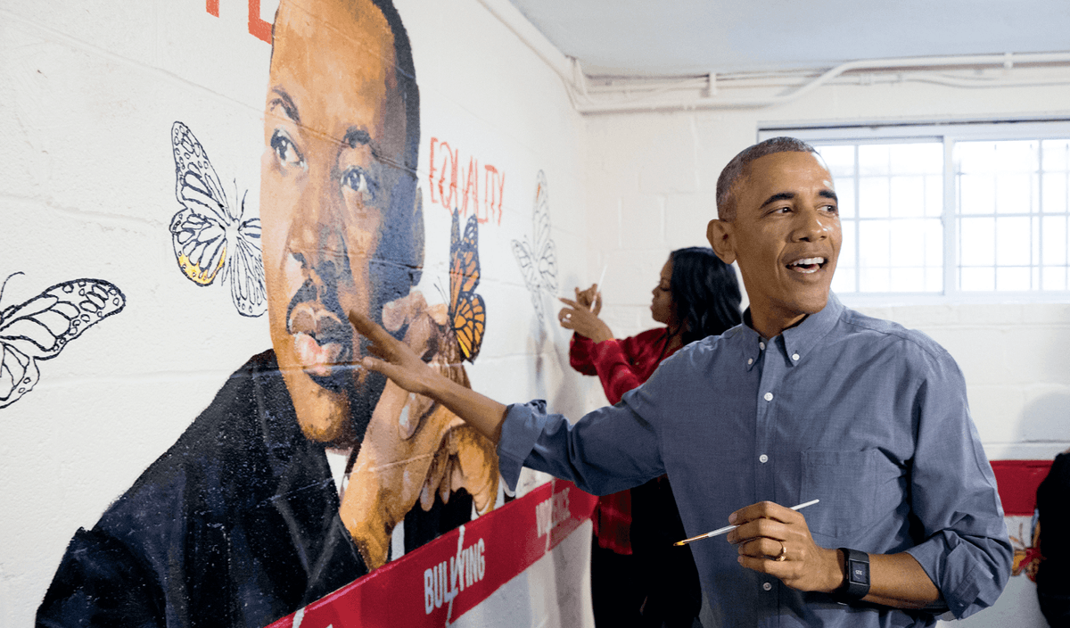  Barack Obama helps finish a mural on Martin Luther King Day, Washington DC, 2017
