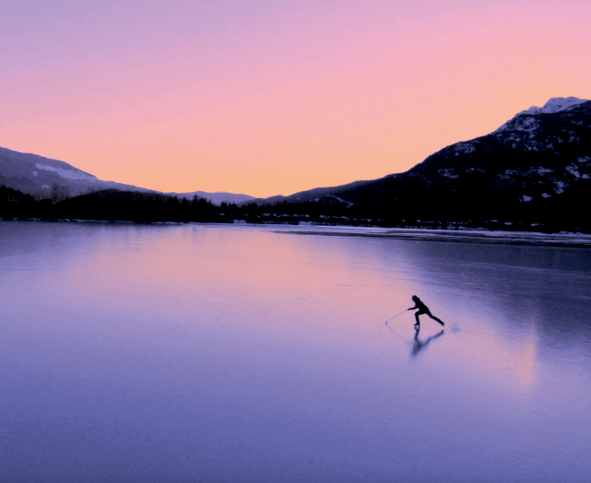 landscape - someone skating on a frozen lake